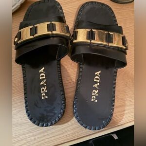 Prada Black Slides with Gold Detailing